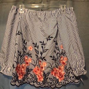 Adorable off the shoulder shirt.